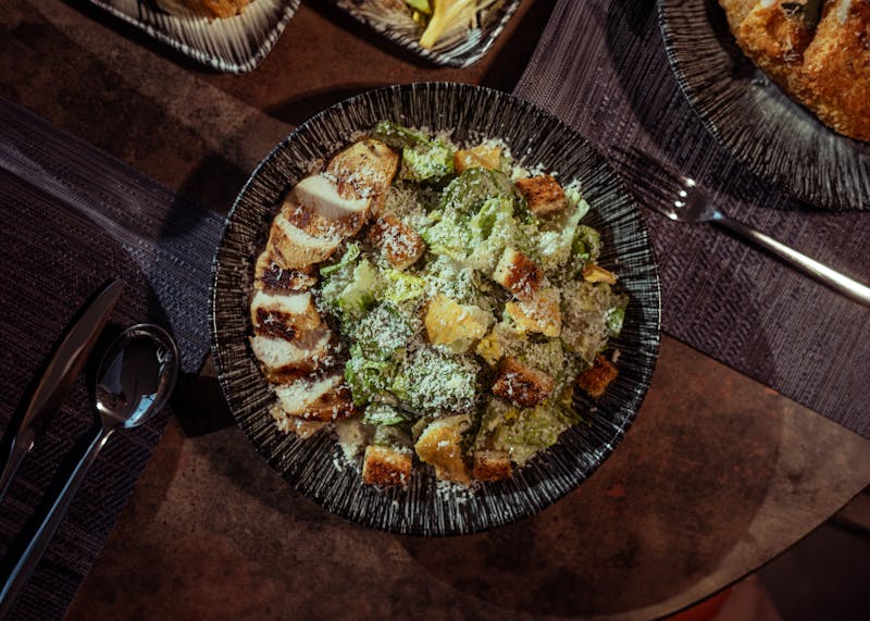 Signature Imos Pizza slice showing the classic square cut style