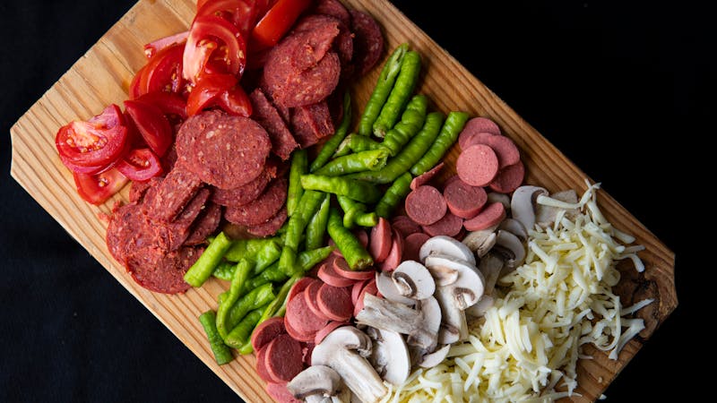 Pizza with deluxe toppings including pepperoni and vegetables